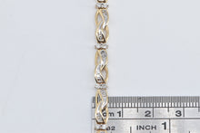 Load image into Gallery viewer, 10K 1.50 Ctw Baguette Diamond Wavy Link Tennis Bracelet 7" Yellow Gold