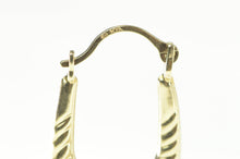 Load image into Gallery viewer, 10K Scalloped Twist Design Oval Hoop Earrings Yellow Gold