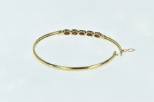 Load image into Gallery viewer, 10K Oval Garnet Diamond Accent Bangle Bracelet 6.5&quot; Yellow Gold