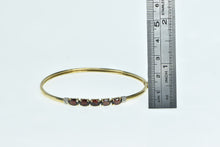 Load image into Gallery viewer, 10K Oval Garnet Diamond Accent Bangle Bracelet 6.5&quot; Yellow Gold