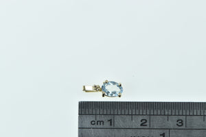 10K Oval Blue Topaz Diamond Accent Classic Pendant Yellow Gold