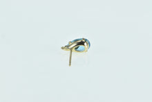 Load image into Gallery viewer, 10K Pear Blue Topaz Single Stud Leaf Accent Earring Yellow Gold