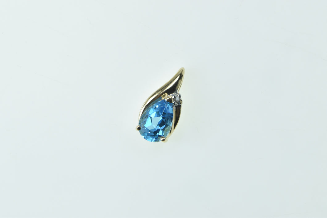 10K Pear Blue Topaz Diamond Accent Fashion Pendant Yellow Gold