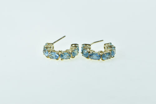 14K 15.4mm Oval Cut Blue Topaz Hoop Earrings Yellow Gold