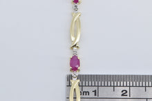 Load image into Gallery viewer, 10K Oval Natural Ruby Diamond Accent Twist Link Bracelet 7&quot; Yellow Gold