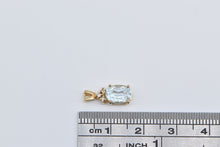 Load image into Gallery viewer, 10K Oval Blue Topaz Diamond Cluster Fashion Pendant Yellow Gold