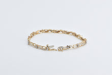 Load image into Gallery viewer, 10K 1.50 Ctw Baguette Diamond Wavy Link Tennis Bracelet 7&quot; Yellow Gold