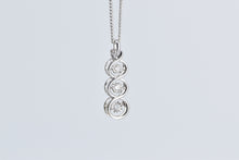 Load image into Gallery viewer, 10K Tiered Dancing Diamond Three Stone Twist Pendant White Gold