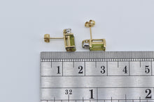 Load image into Gallery viewer, 14K Emerald Cut Peridot Baguette Diamond Stud Earrings Yellow Gold