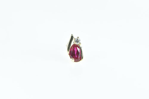 10K Single Oval Syn. Ruby Diamond Accent Stud Earring Yellow Gold