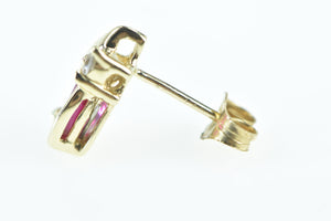 10K Single Oval Syn. Ruby Diamond Accent Stud Earring Yellow Gold