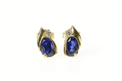 14K Oval Syn. Sapphire CZ Accent Stud Earrings Yellow Gold