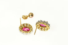 Load image into Gallery viewer, 10K Oval Syn. Ruby CZ Halo Classic Screw Back Earrings Yellow Gold