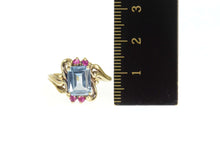 Load image into Gallery viewer, 10K Emerald Cut Blue Topaz Synthetic Ruby Bypass Ring Size 6 Yellow Gold