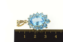 Load image into Gallery viewer, 14K Oval Blue Topaz Halo Classic Statement Pendant Yellow Gold