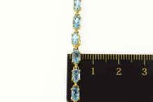 Load image into Gallery viewer, 10K Oval Blue Topaz Classic Statement Tennis Bracelet 7.75&quot; Yellow Gold