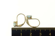 Load image into Gallery viewer, 10K Oval Blue Topaz Solitaire Classic Stud Earrings Yellow Gold