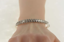 Load image into Gallery viewer, Sterling Silver Baguette &amp; Round Cubic Zirconia Bangle Bracelet 7&quot;