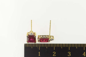 10K Emerald Cut Syn. Ruby Diamond Accent Stud Earrings Yellow Gold