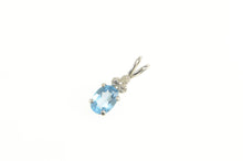 Load image into Gallery viewer, 14K Oval Blue Topaz Diamond Cluster Accent Pendant White Gold