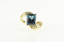 Load image into Gallery viewer, 14K Emerald Cut Blue Topaz Diamond Bypass Ring Yellow Gold
