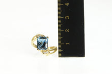 Load image into Gallery viewer, 14K Emerald Cut Blue Topaz Diamond Bypass Ring Yellow Gold