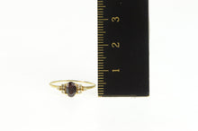 Load image into Gallery viewer, 14K 0.63 Ctw Oval Garnet Diamond Accent Ring Yellow Gold