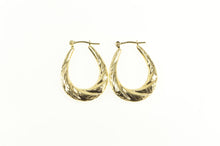 Load image into Gallery viewer, 14K Puffy Scalloped Twist Oval Diamond Cut Hoop Earrings Yellow Gold