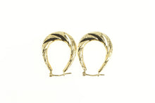Load image into Gallery viewer, 14K Puffy Scalloped Twist Oval Diamond Cut Hoop Earrings Yellow Gold