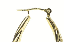 Load image into Gallery viewer, 14K Puffy Scalloped Twist Oval Diamond Cut Hoop Earrings Yellow Gold