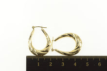 Load image into Gallery viewer, 14K Puffy Scalloped Twist Oval Diamond Cut Hoop Earrings Yellow Gold
