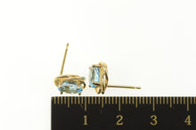 Load image into Gallery viewer, 14K Oval Blue Topaz Twist Trim Classic Stud Earrings Yellow Gold