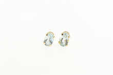 Load image into Gallery viewer, 10K Oval Syn. Aquamarine Solitaire Stud Earrings Yellow Gold