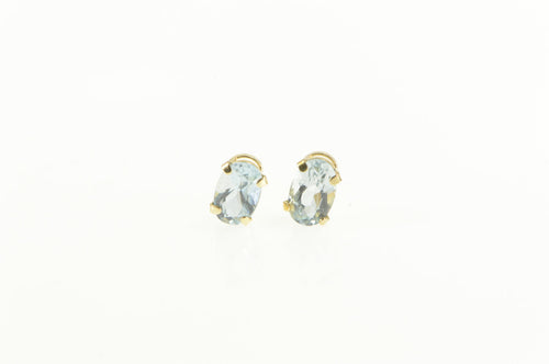 10K Oval Syn. Aquamarine Solitaire Stud Earrings Yellow Gold