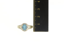 Load image into Gallery viewer, 14K Oval Blue Topaz Diamond Halo Engagement Ring Yellow Gold