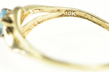 Load image into Gallery viewer, 10K Oval Blue Topaz Diamond Accent Statement Ring Yellow Gold