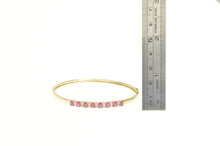Load image into Gallery viewer, 10K Natural Oval Ruby Diamond Accent Oval Bangle Bracelet 6.5&quot; Yellow Gold