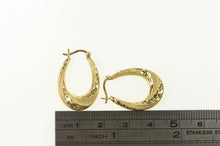 Load image into Gallery viewer, 14K Diamond Cut Retro Puffy Twist Oval Hoop Earrings Yellow Gold