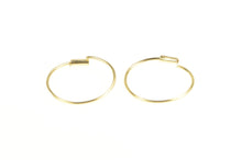 Load image into Gallery viewer, 14K 12.5mm Wire Seamless Look Huggies Hoop Earrings Yellow Gold