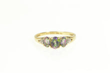 Load image into Gallery viewer, 10K Three Stone Oval Mystic Topaz CZ Accent Ring Yellow Gold