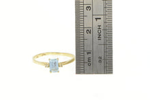 Load image into Gallery viewer, 10K Emerald Cut Blue Topaz Diamond Accent Ring Yellow Gold