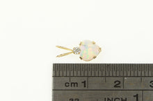 Load image into Gallery viewer, 10K Heart Syn. Opal CZ Accent Love Symbol Pendant Yellow Gold