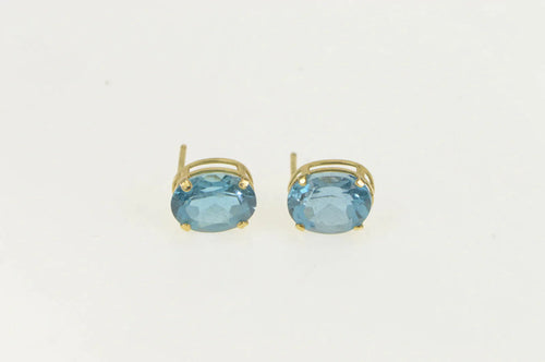 14K Oval Blue Topaz Solitaire Classic Stud Earrings Yellow Gold