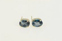 Load image into Gallery viewer, 10K Oval London Blue Topaz Solitaire Stud Earrings Yellow Gold