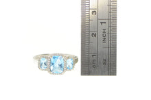 Load image into Gallery viewer, 10K Blue Topaz Three Stone Diamond Halo Ring White Gold