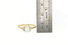 Load image into Gallery viewer, 10K Oval Syn. Opal Diamond Cluster Accent Ring Yellow Gold