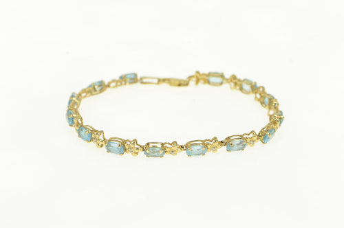 14K Oval Blue Topaz Diamond Flower Tennis Bracelet 7
