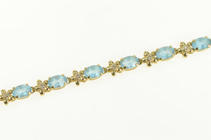 14K Oval Blue Topaz Diamond Flower Tennis Bracelet 7" Yellow Gold