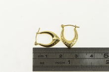 Load image into Gallery viewer, 14K Chevron Diamond Cut Textured Oval Hoop Earrings Yellow Gold